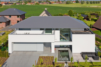 Woning met leien te Woumen, België